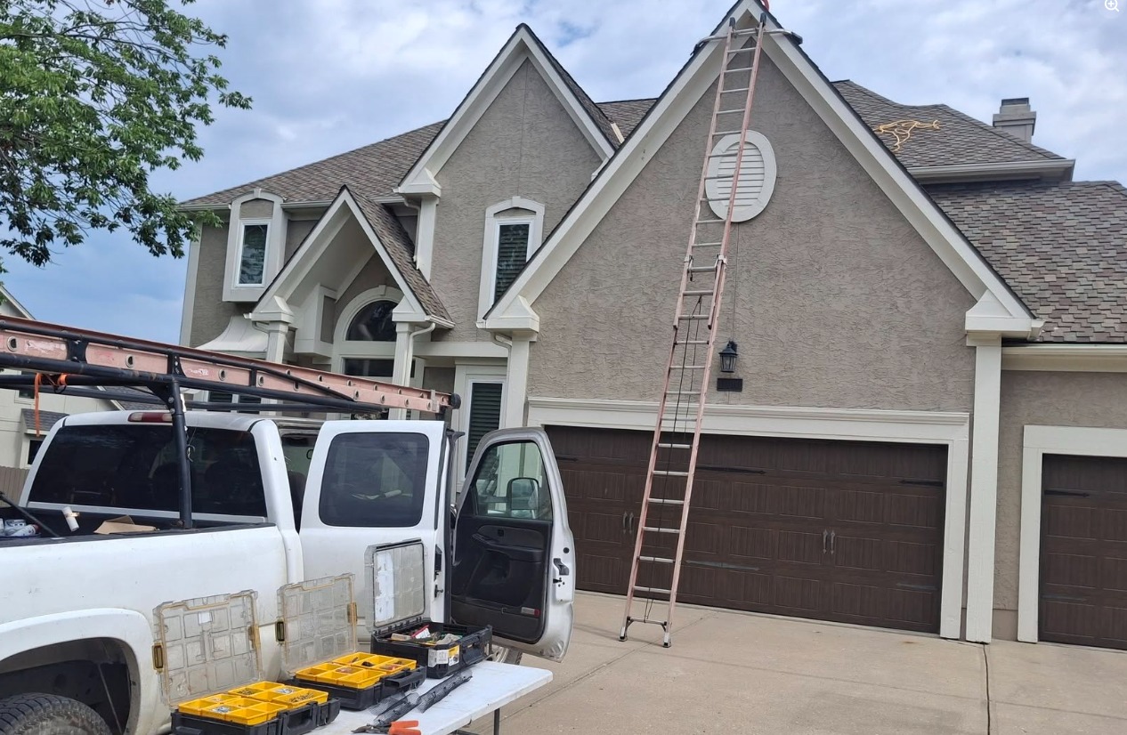 Ozark Bat Specialist truck, equipment, and ladder at a Missouri home
